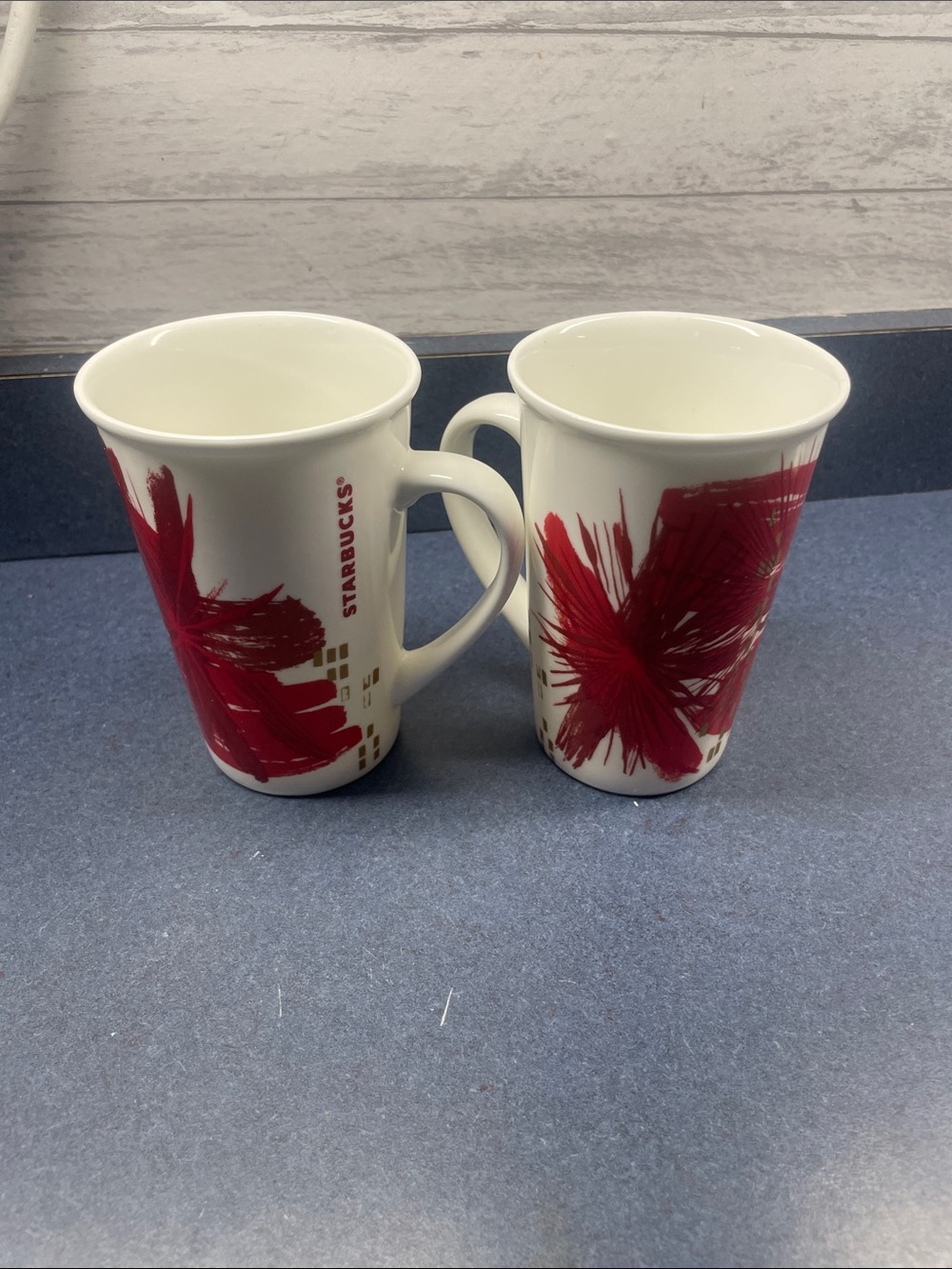 Starbucks White Ceramic Mugs with Bold Red Brushstroke Accents